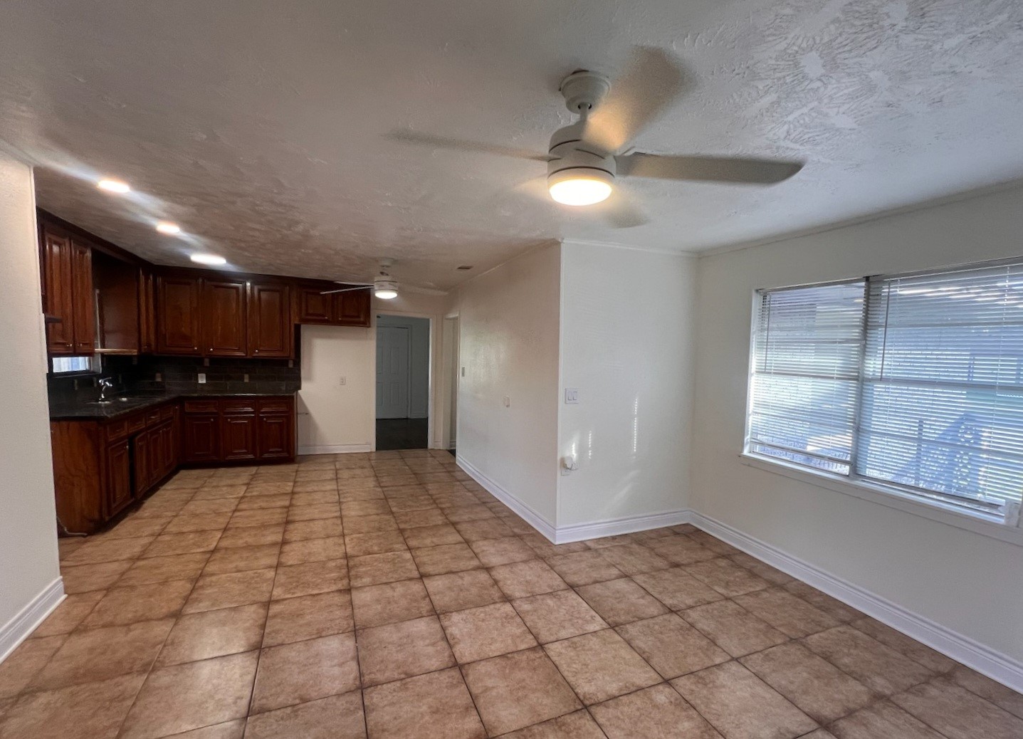 2146 Minnesota Street Houston, TX 77034 - Photo 4 of 22 a big room with chandelier fan and windows