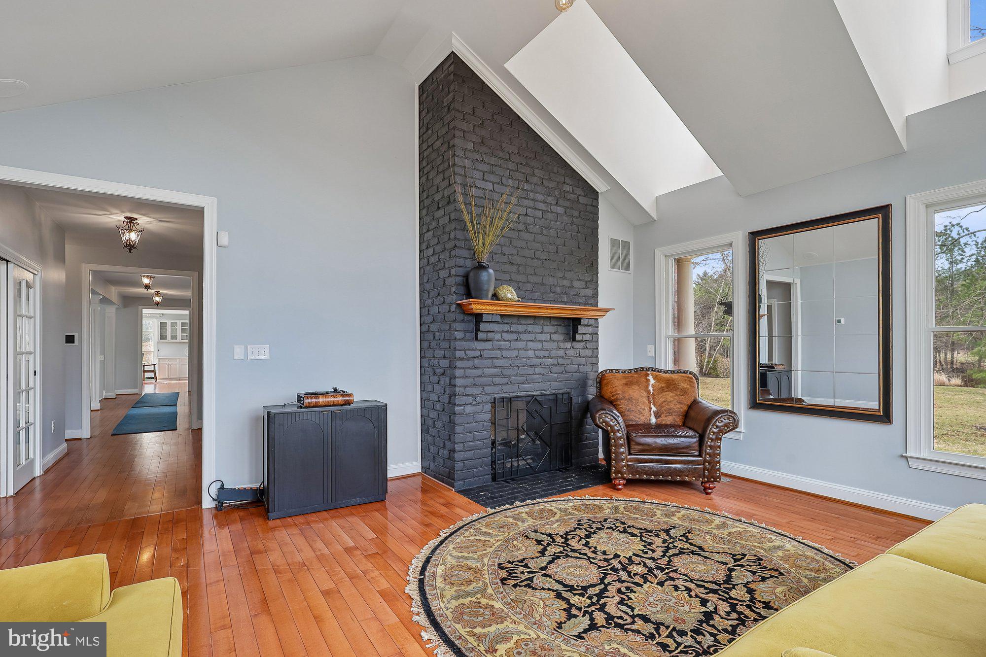 1303 Windsor Ridge Lane Annapolis, MD 21409 - Photo 9 of 40 Sun Room with 2 sided gas fireplace