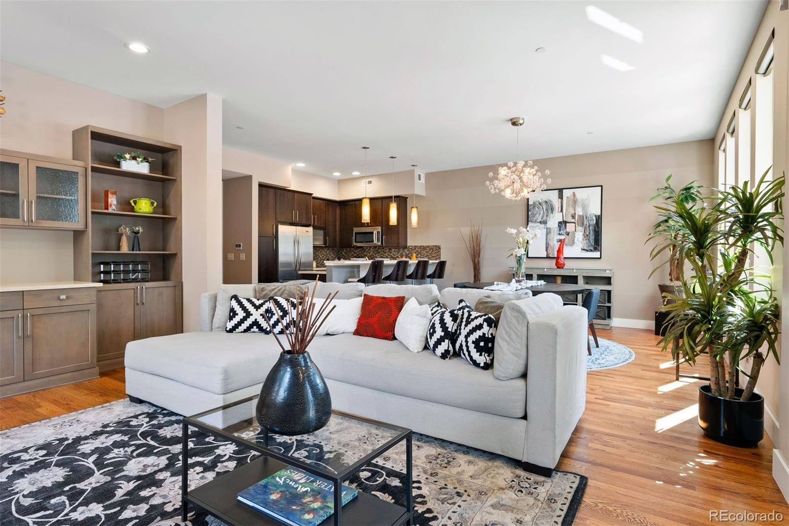 340 South Lafayette Street, Unit 102 Denver, CO 80209 - Photo 1 of 35 a living room with furniture and a rug