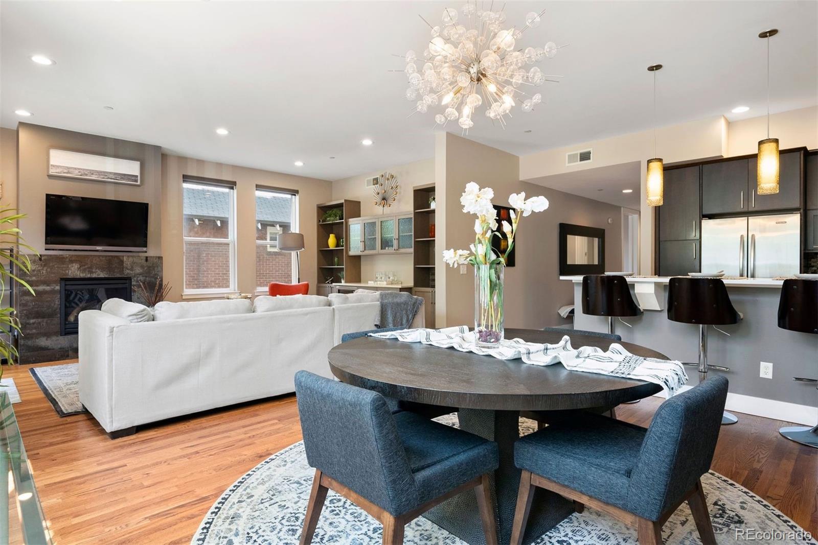 340 South Lafayette Street, Unit 102 Denver, CO 80209 - Photo 11 of 35 a living room with fireplace furniture and a flat screen tv