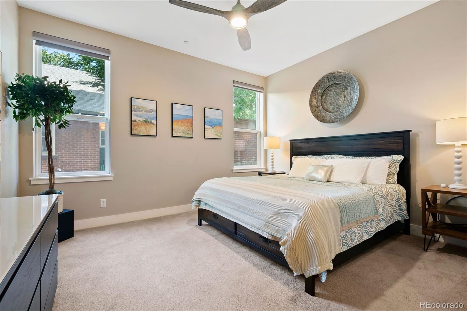 340 South Lafayette Street, Unit 102 Denver, CO 80209 - Photo 16 of 35 a bedroom with a bed and a potted plant