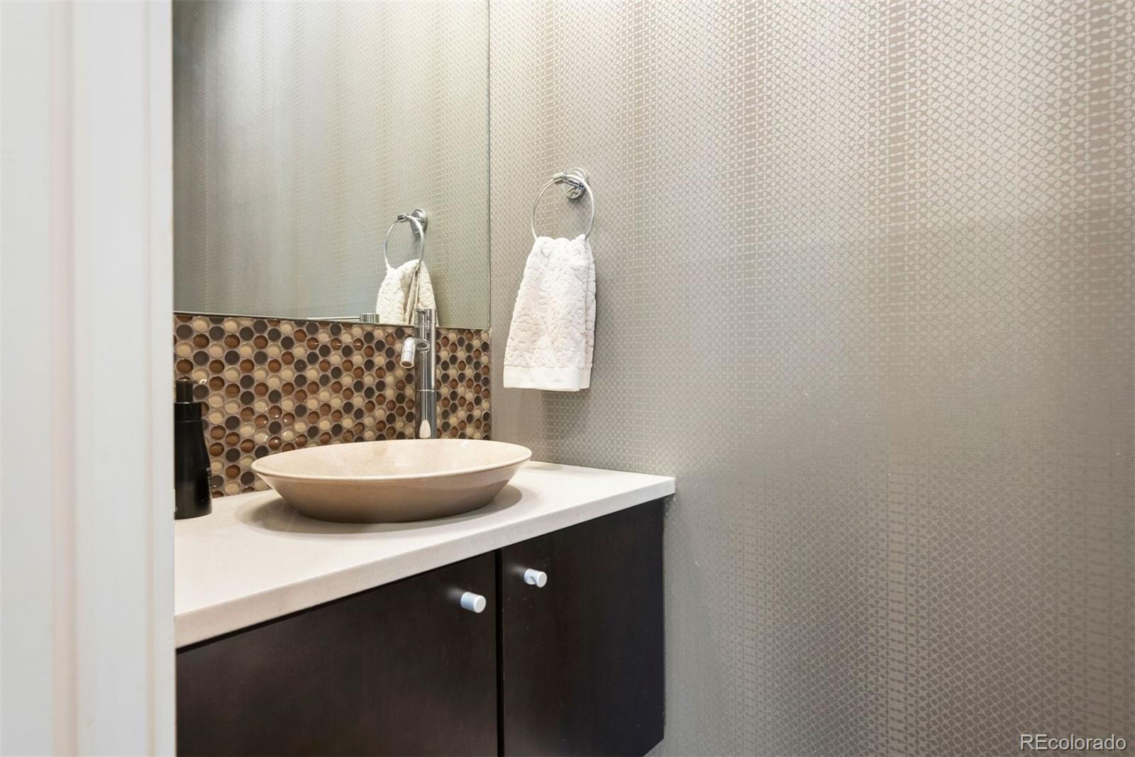 340 South Lafayette Street, Unit 102 Denver, CO 80209 - Photo 29 of 35 a bathroom with a sink and a mirror
