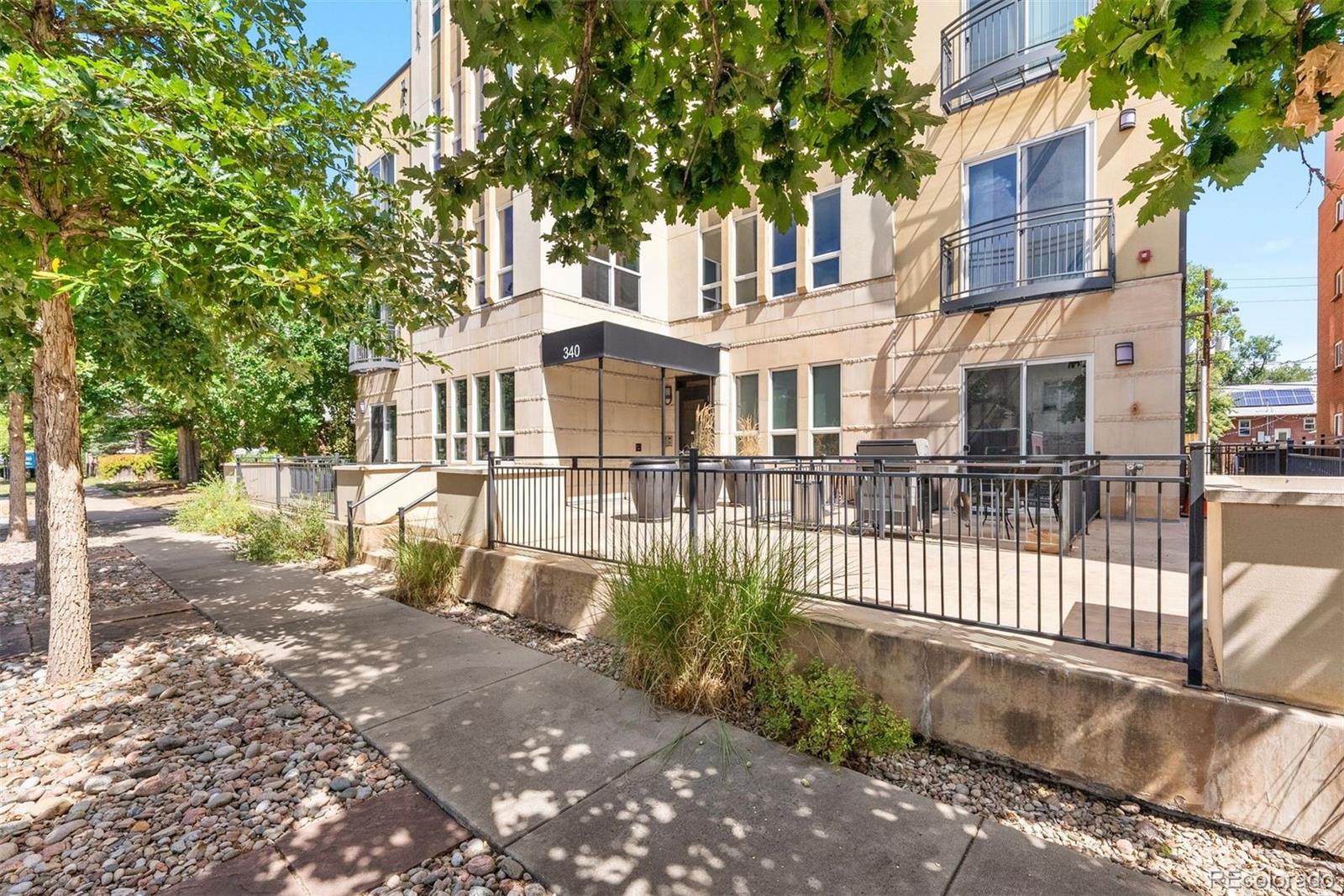 340 South Lafayette Street, Unit 102 Denver, CO 80209 - Photo 33 of 35 front view of a house with a yard
