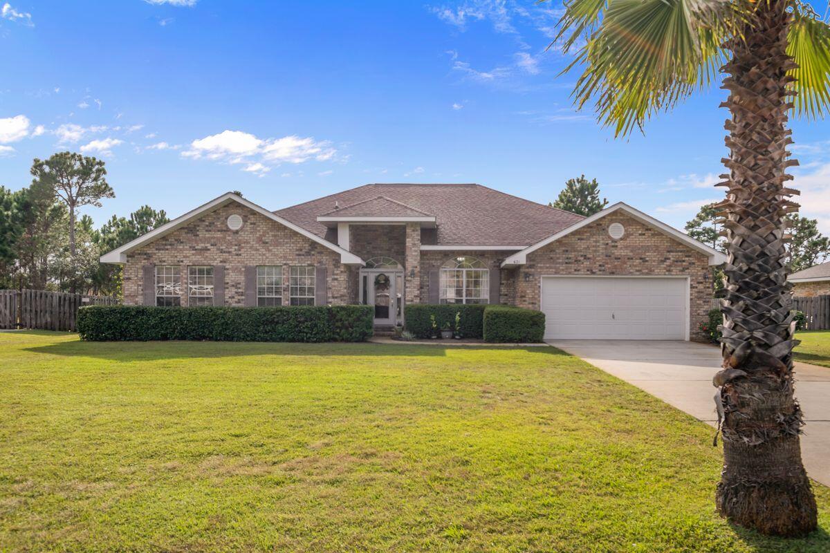 621 East Shipwreck Road Santa Rosa Beach, FL 32459 - Photo 1 of 25 a front view of house with yard and swimming pool