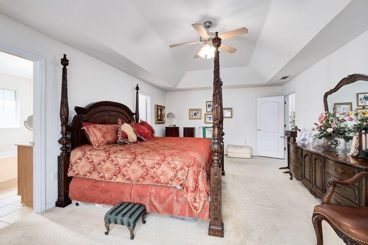 621 East Shipwreck Road Santa Rosa Beach, FL 32459 - Photo 14 of 25 a bedroom with a bed and a chandelier