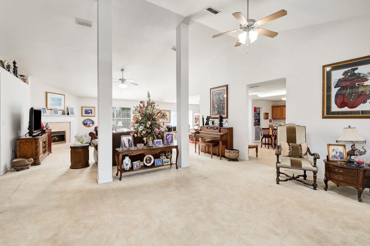 621 East Shipwreck Road Santa Rosa Beach, FL 32459 - Photo 3 of 25 a living room with furniture and a chandelier