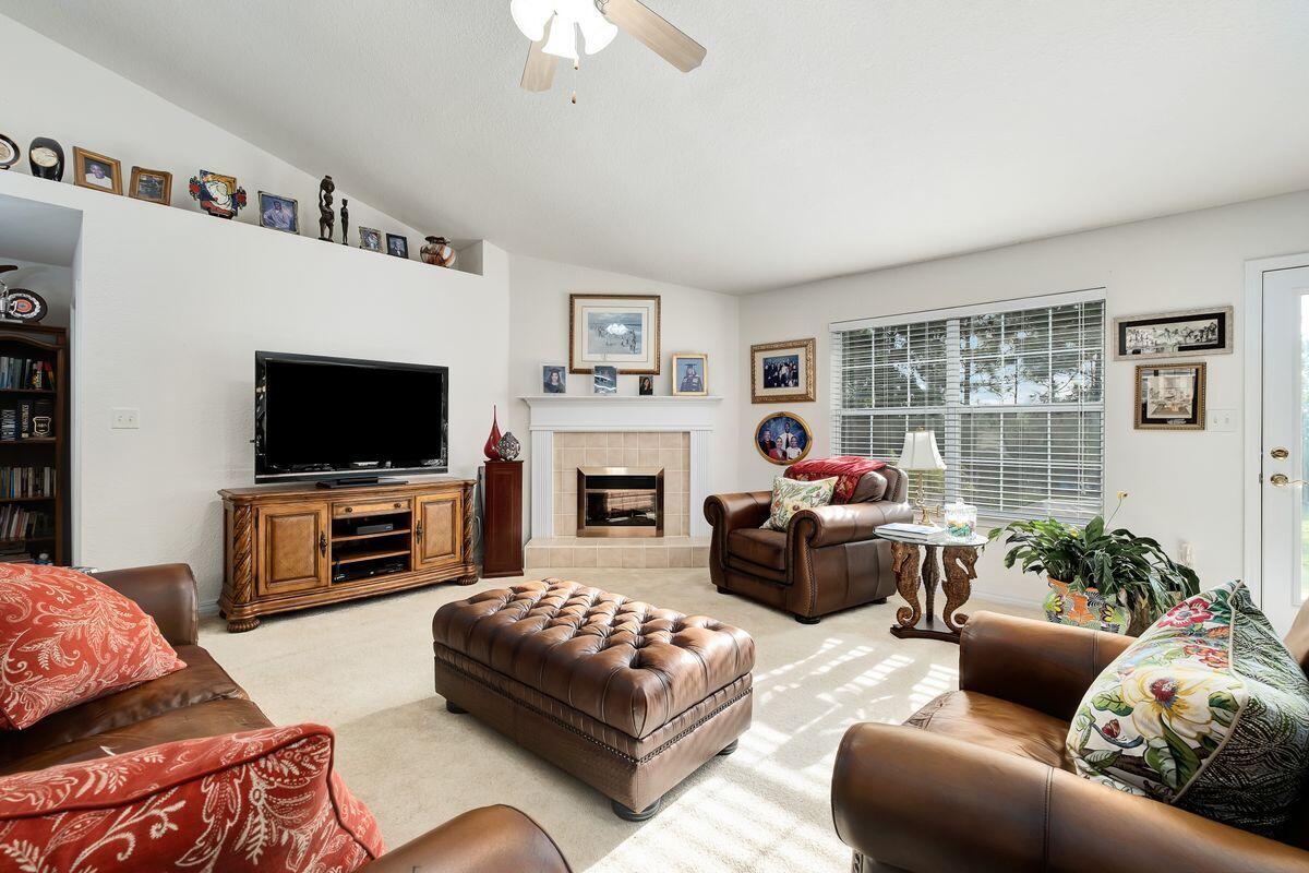 621 East Shipwreck Road Santa Rosa Beach, FL 32459 - Photo 5 of 25 a living room with furniture a flat screen tv and a fireplace