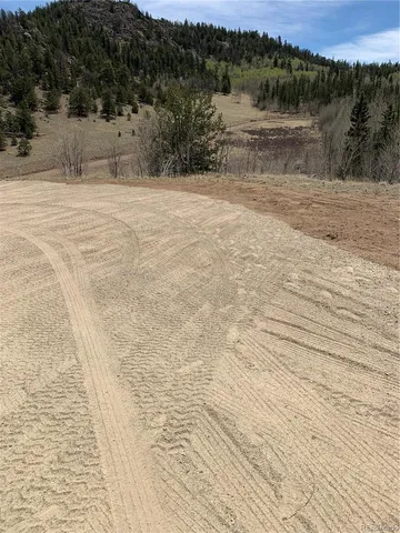 a view of a car parked in the yard