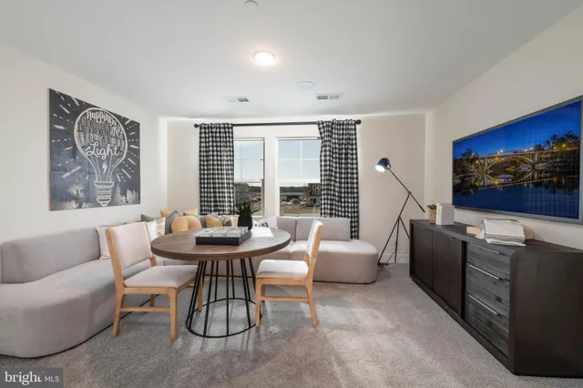 a living room with fireplace furniture and a flat screen tv