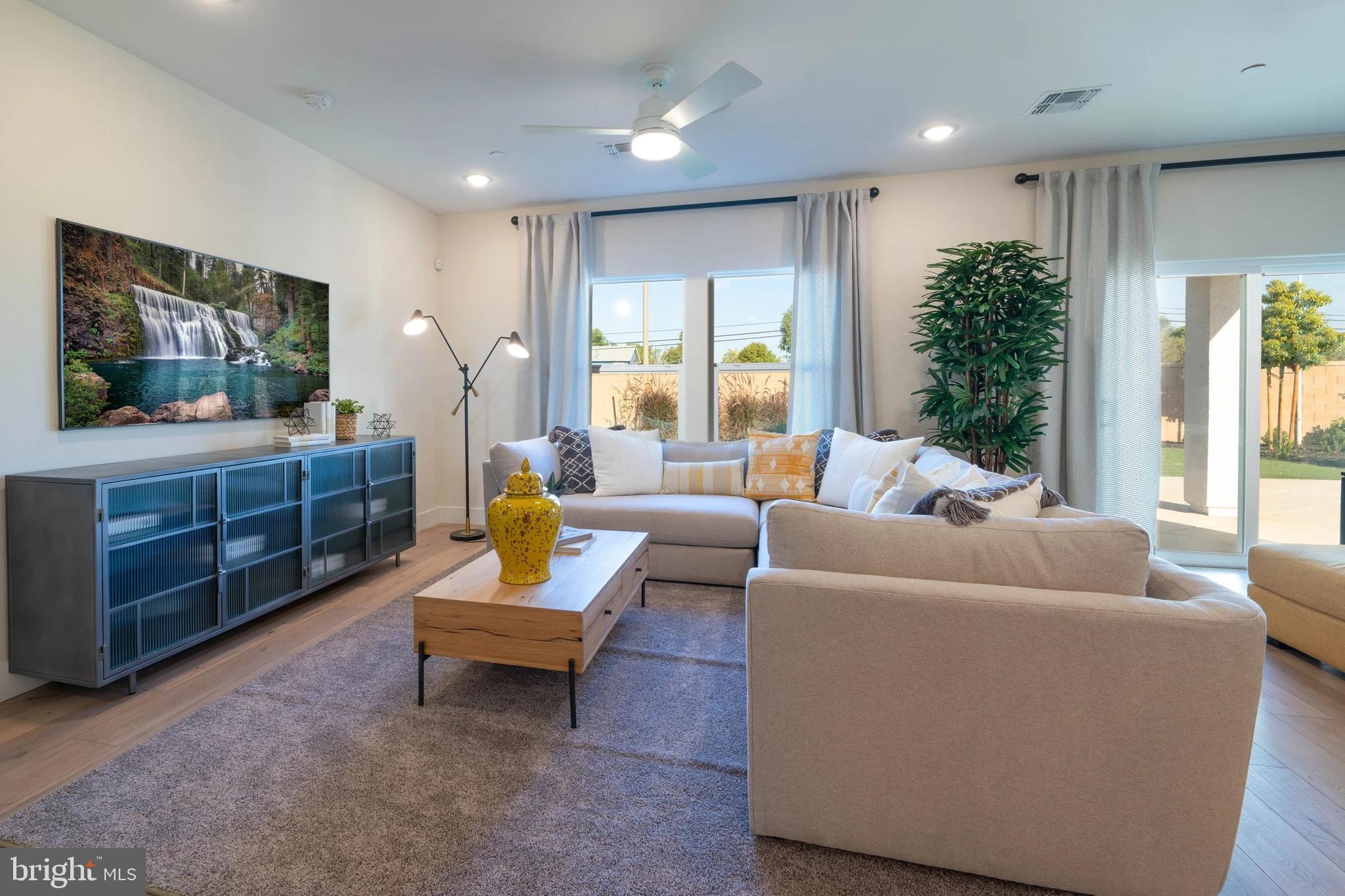 106 Thornton Avenue Ranson, WV 25438 - Photo 9 of 29 a living room with furniture and a flat screen tv