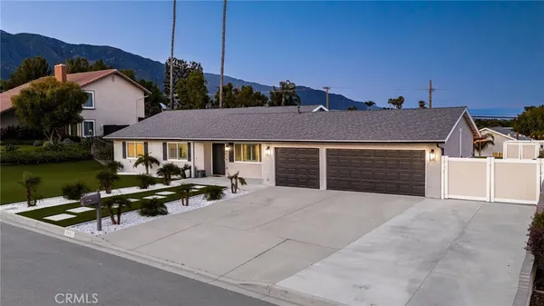 a view of house with yard outdoor seating and barbeque
