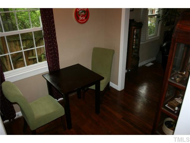 2104 Ruffin Street Durham, NC 27704 - Photo 8 of 18 Comfortable dining room with lots of light and easy access to the family room or kitchen. The hardwood floors really draw the accent. Dining Room