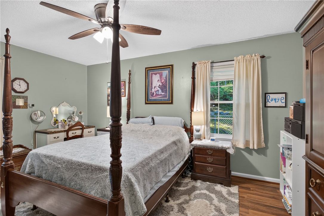 104 Laurel Lane Seneca, SC 29678 - Photo 13 of 36 A comforting bedroom offering ample space and natural illumination for restful moments.