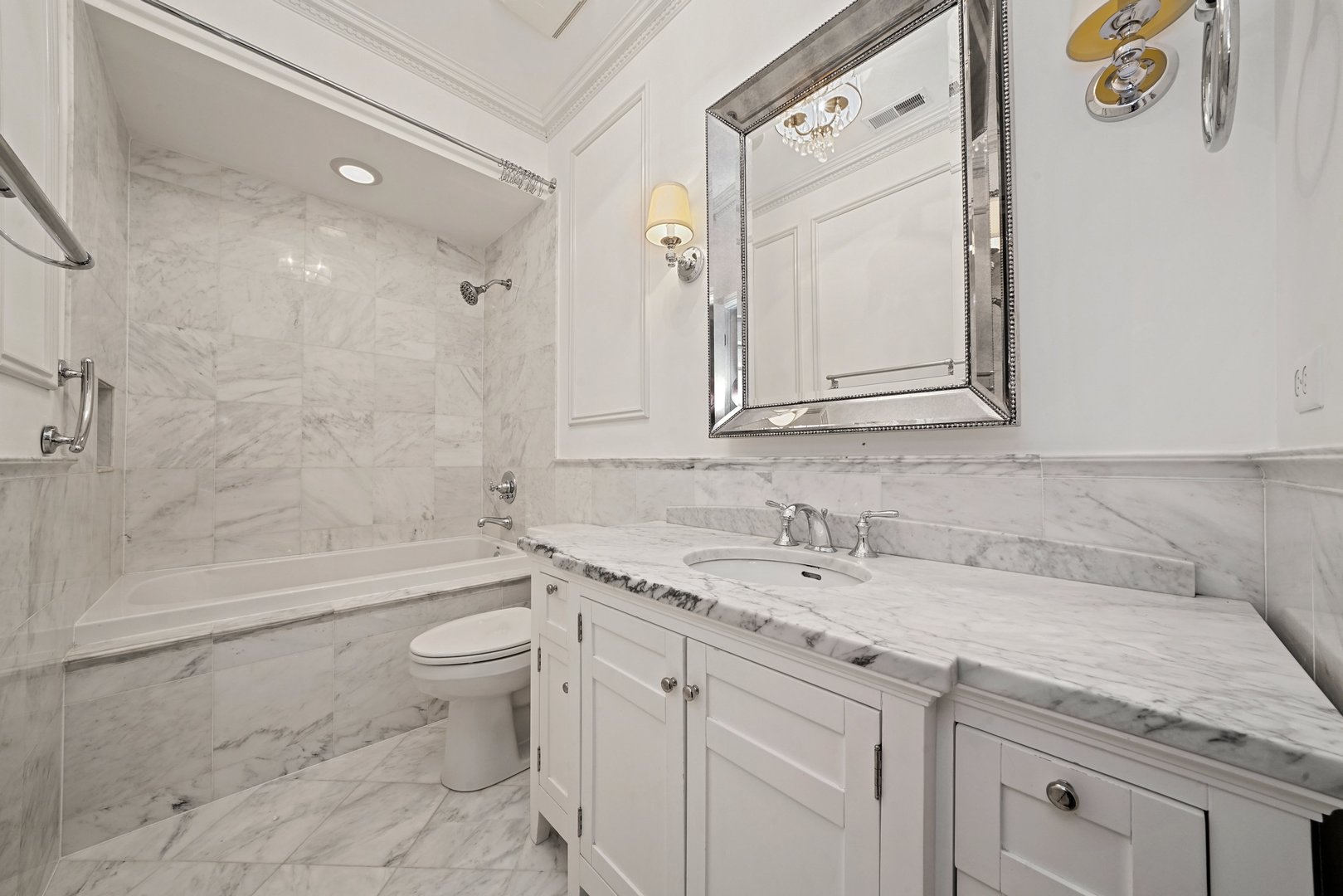 1703 South Prairie Avenue Chicago, IL 60616 - Photo 23 of 34 a bathroom with a granite countertop sink a toilet and a bathtub