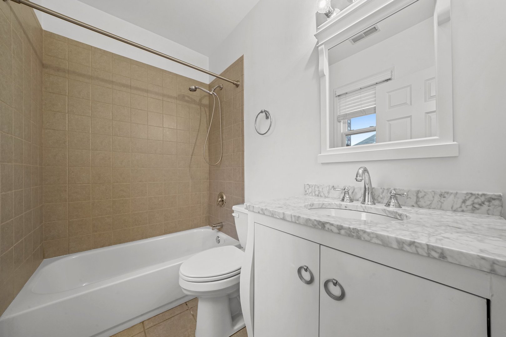 1703 South Prairie Avenue Chicago, IL 60616 - Photo 28 of 34 a bathroom with a granite countertop sink toilet and shower