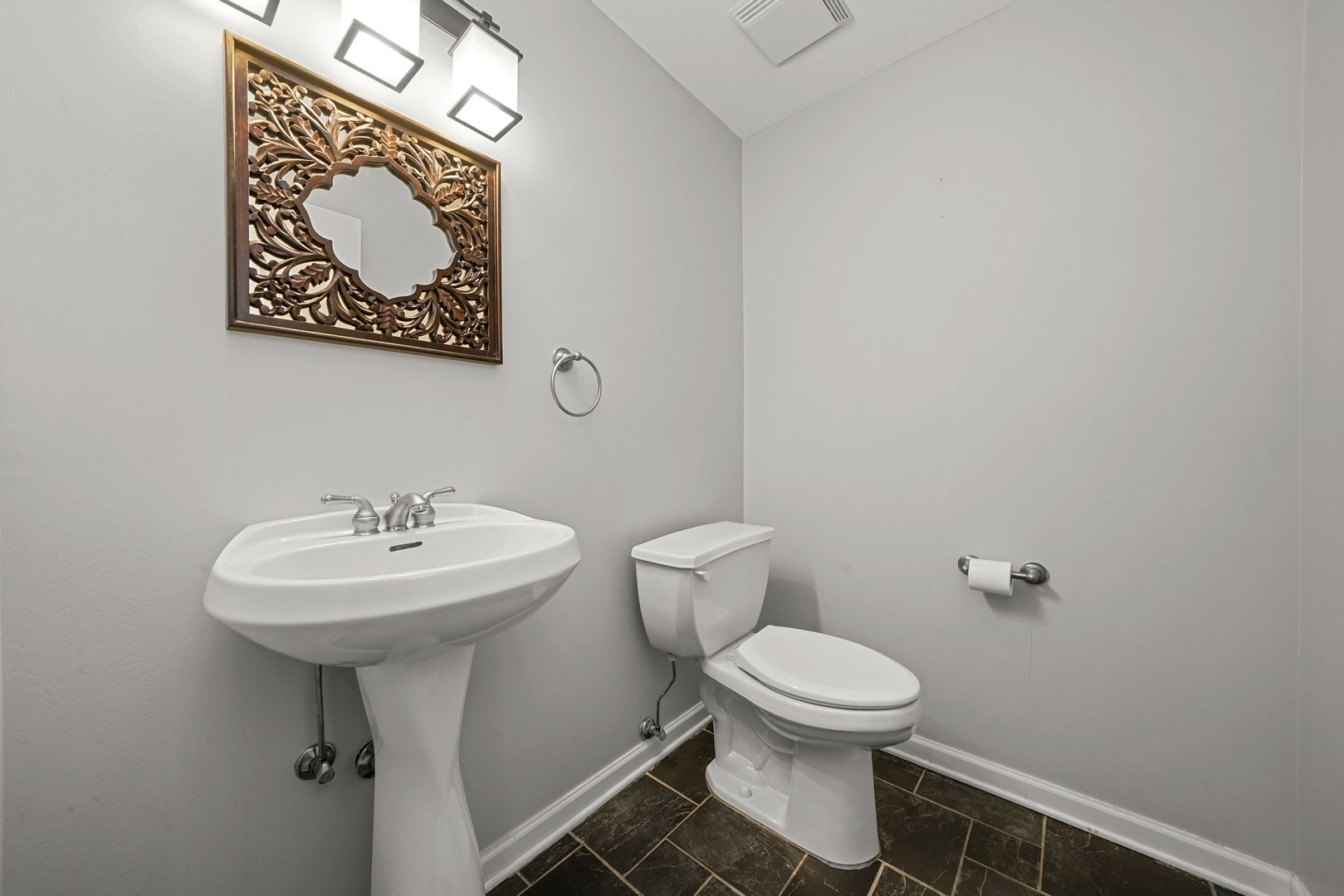 1703 South Prairie Avenue Chicago, IL 60616 - Photo 6 of 34 a bathroom with a toilet sink and mirror
