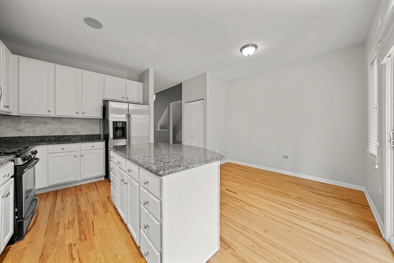 1703 South Prairie Avenue Chicago, IL 60616 - Photo 10 of 34 a kitchen with white cabinets and appliances