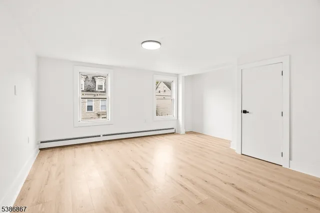 an empty room with a empty space and window