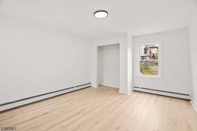 an empty room with a empty space and window