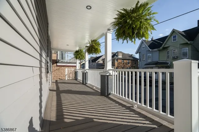a view of a house with a small yard and plants