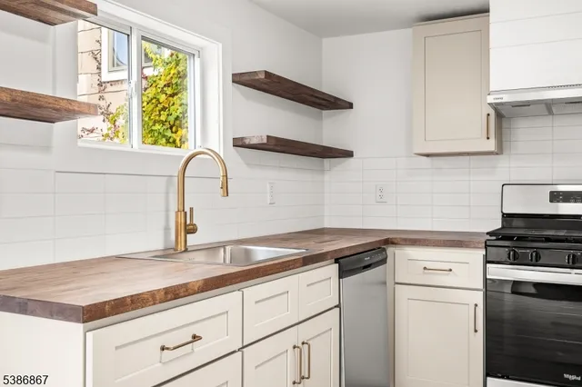 a view of a kitchen with wooden floor