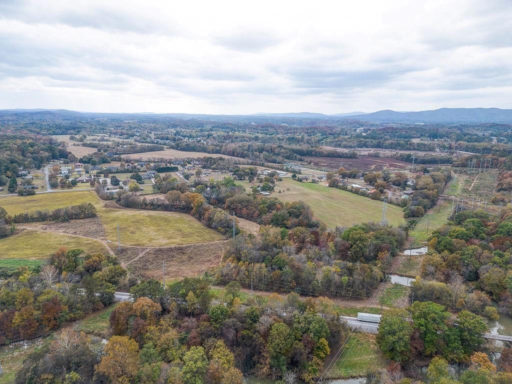 458 McDaniel Station Road Southwest Calhoun, GA 30701 - Photo 2 of 9 an aerial view of residential houses with outdoor space and trees