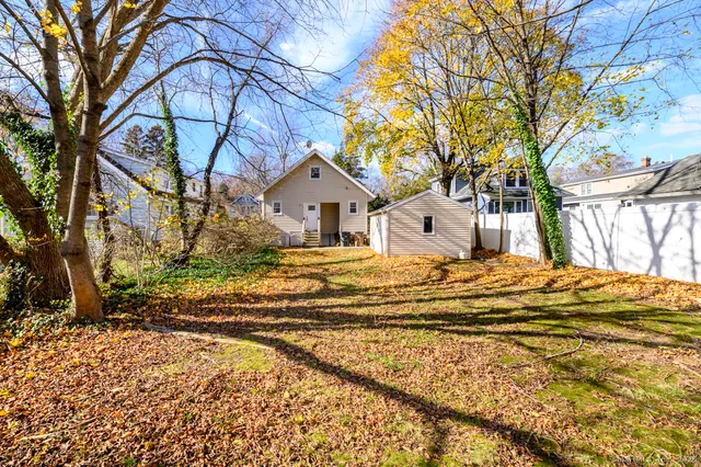 a view of a house with a snow in the yard