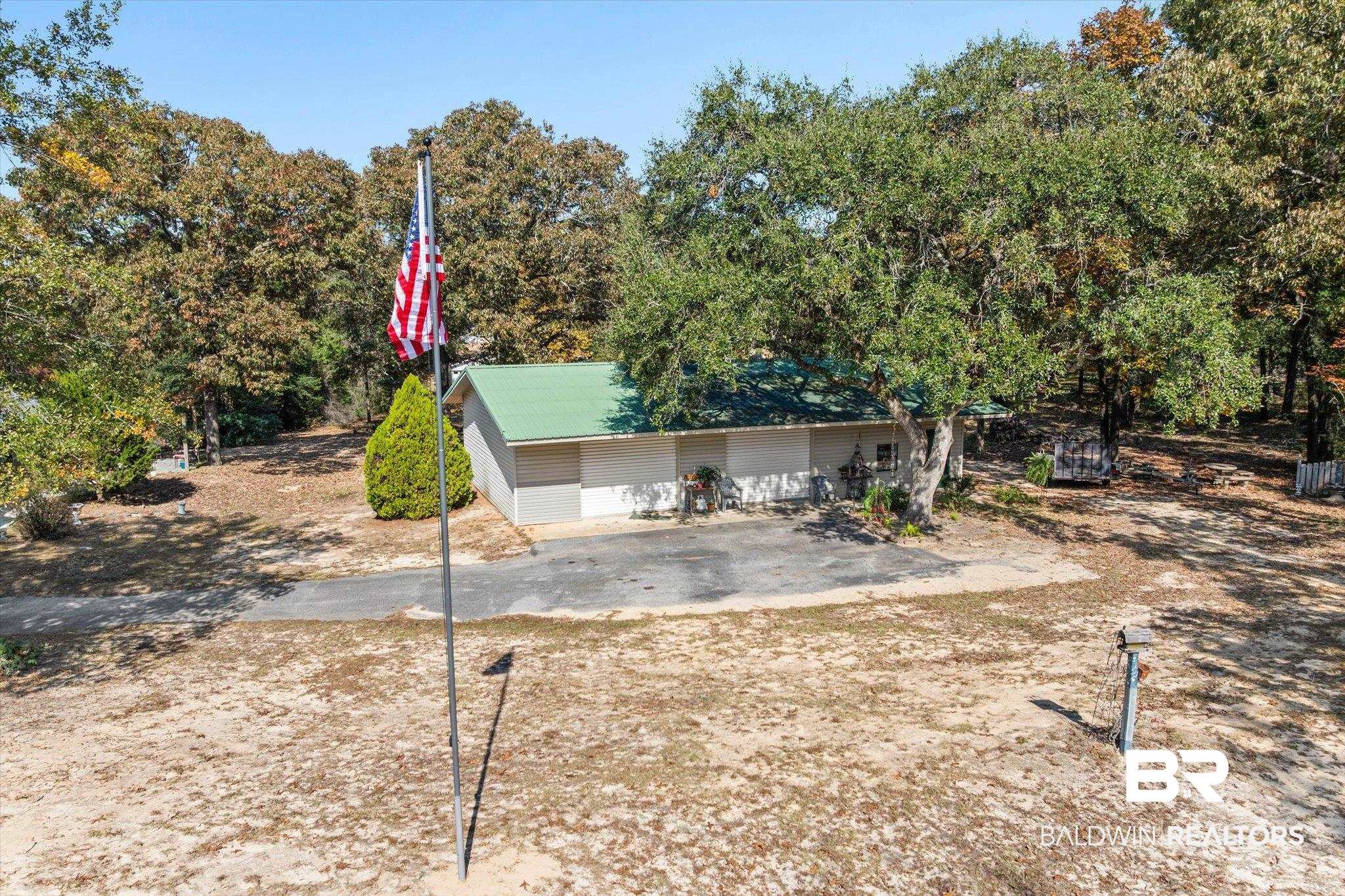 3846 Leslie Road Saraland, AL 36571 - Photo 26 of 40 View of front of property with view of wooded area