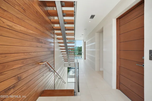 a view of a dining room with furniture wooden floor and chandelier