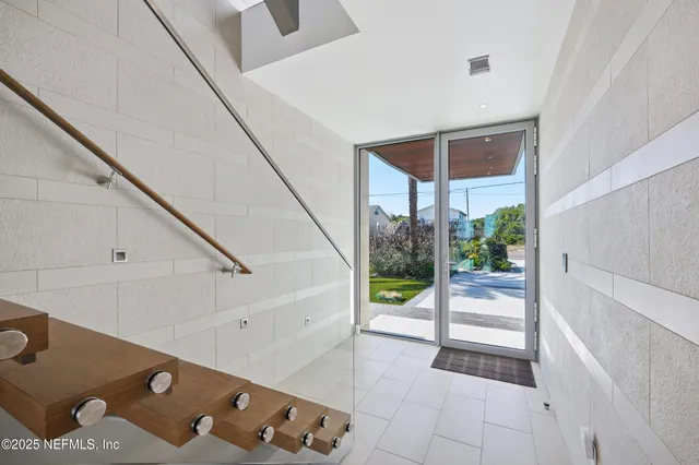 a view of an empty room with gym equipment