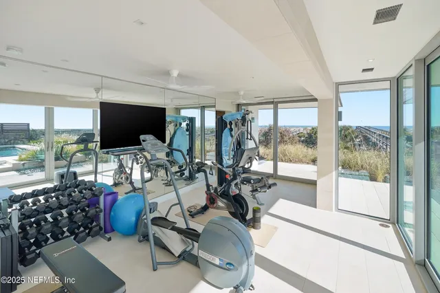 a bedroom with a large bed and a large window