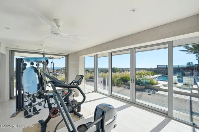 a living room with a large window and a table