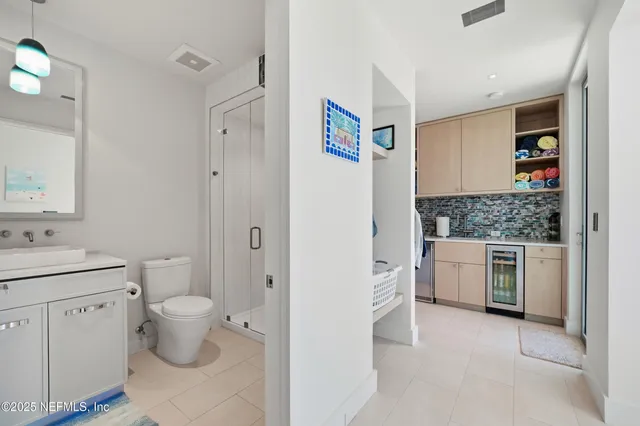a bathroom with a shower and a sink