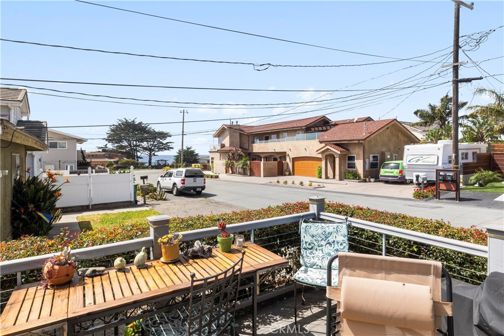 50 5th Street Cayucos, CA 93430 - Photo 11 of 47 a view of a patio with table and chairs potted plants with wooden floor