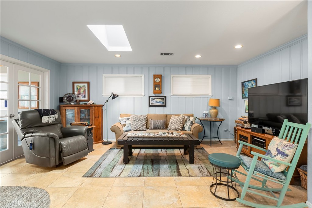 50 5th Street Cayucos, CA 93430 - Photo 26 of 47 a living room with furniture and a flat screen tv