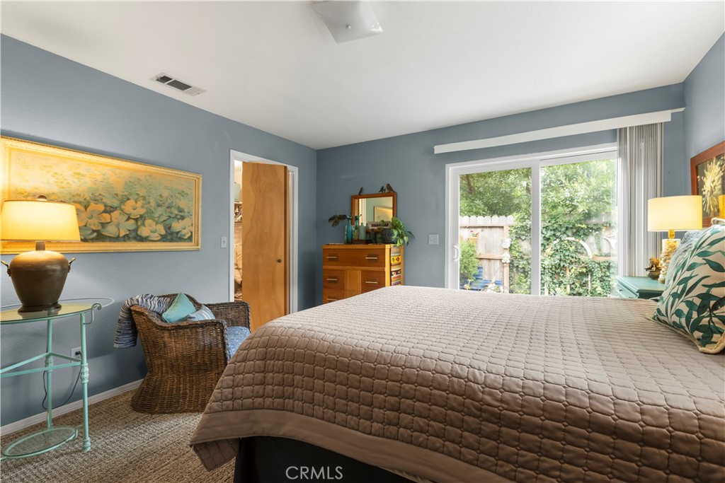 50 5th Street Cayucos, CA 93430 - Photo 31 of 47 a bedroom with a bed and wooden floor