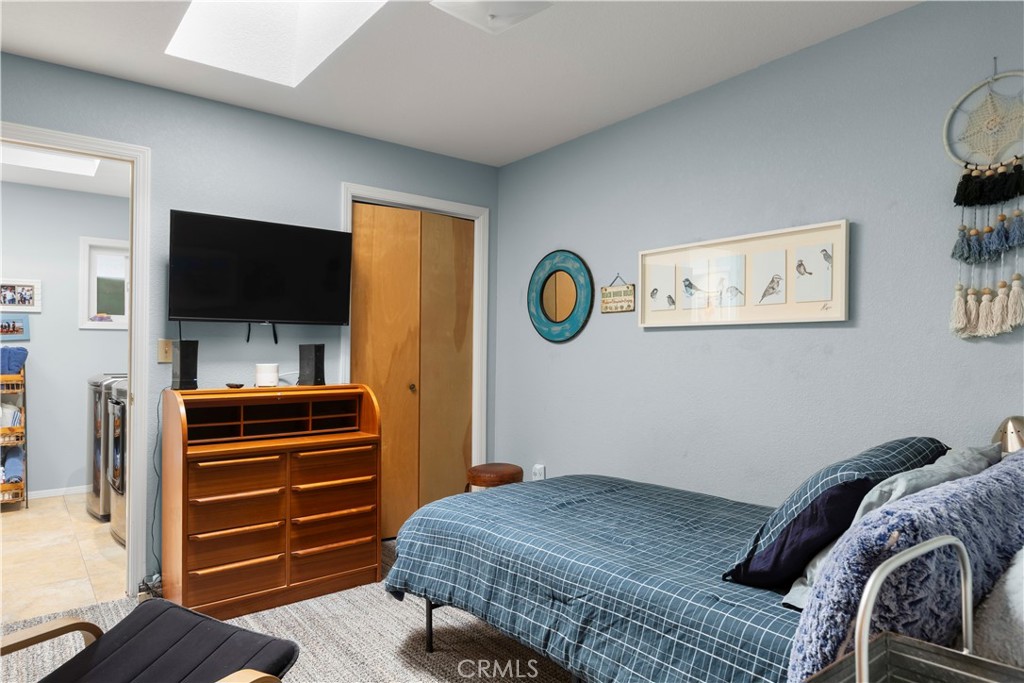 50 5th Street Cayucos, CA 93430 - Photo 35 of 47 a bedroom with a bed and flat screen tv