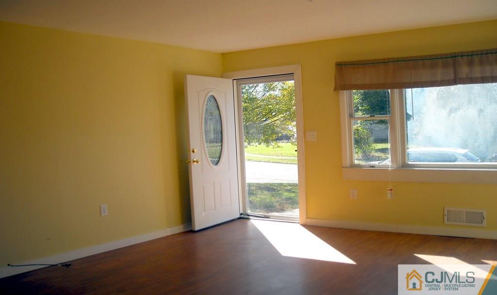 31 Markham Road Edison, NJ 08817 - Photo 3 of 13 a view of an empty room with a window