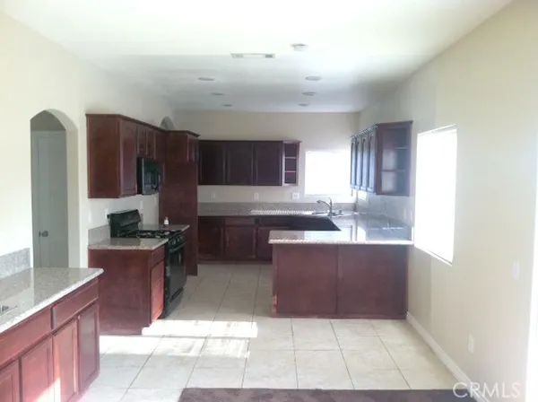 a large kitchen with cabinets and a counter top space