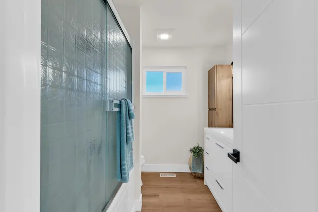 a bathroom with a bathtub and shower