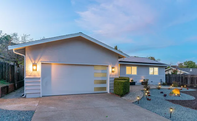 an outdoor view of house with garage