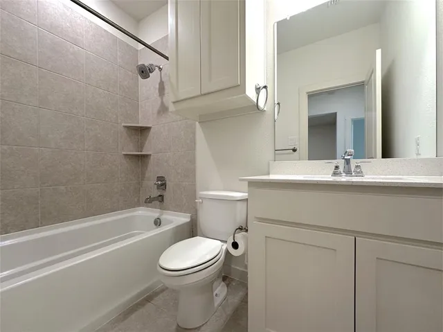 a bathroom with a sink a toilet and a bathtub