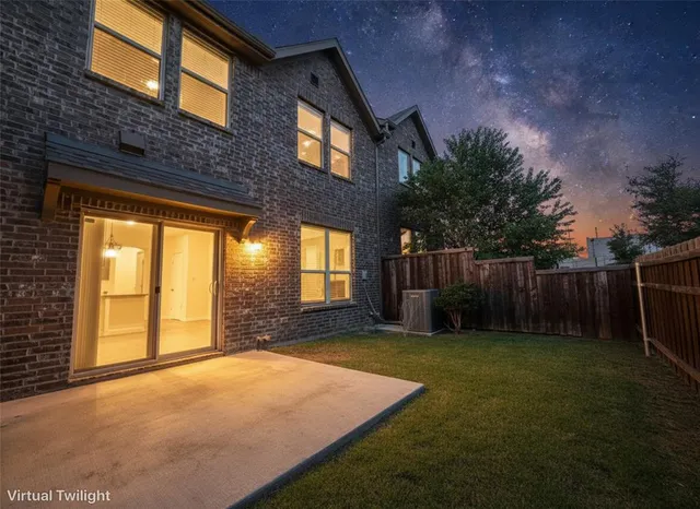 a view of an house with backyard and garden
