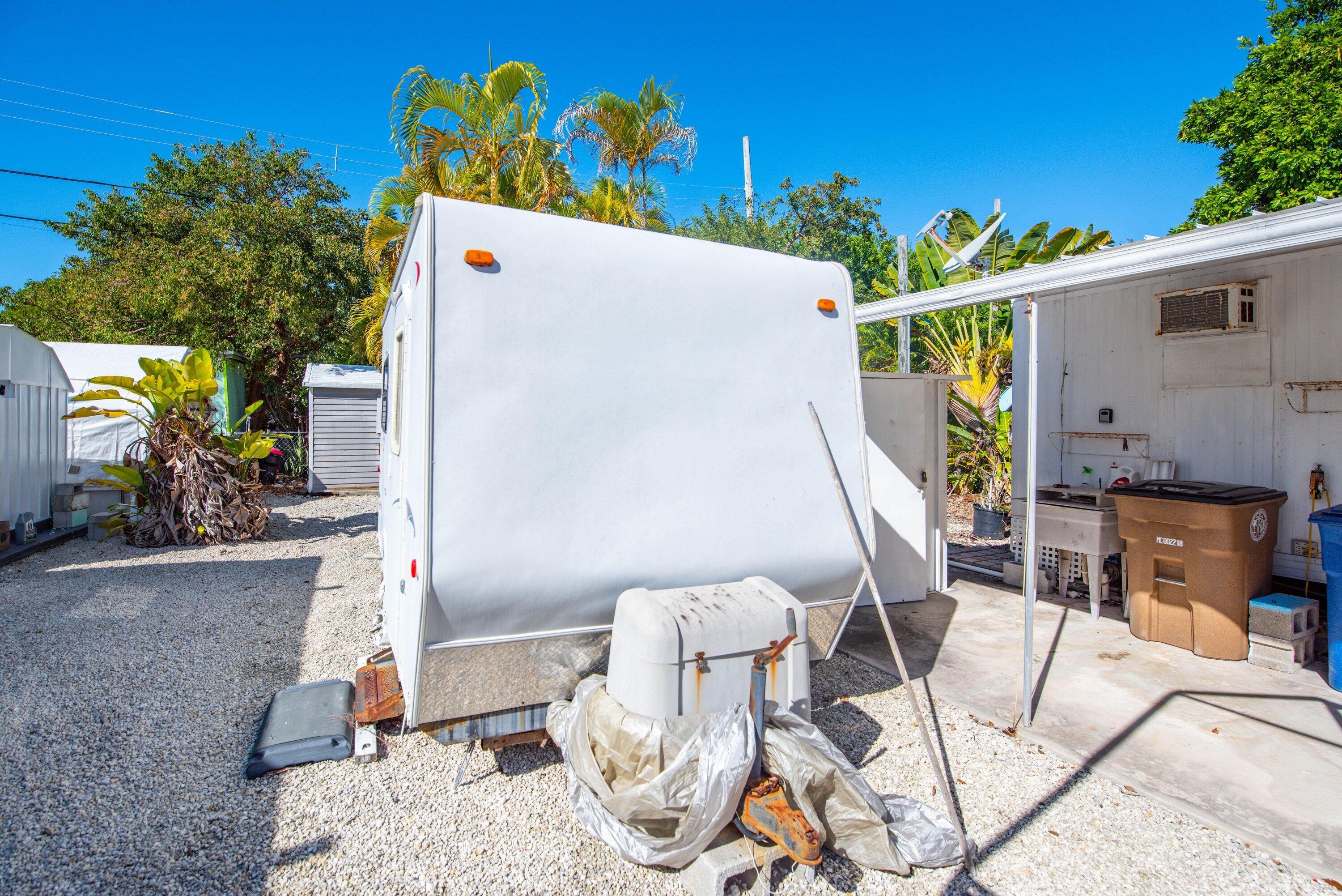 138 Sands Road Big Pine Key, FL 33043 - Photo 11 of 18 a view of a chairs and table in patio