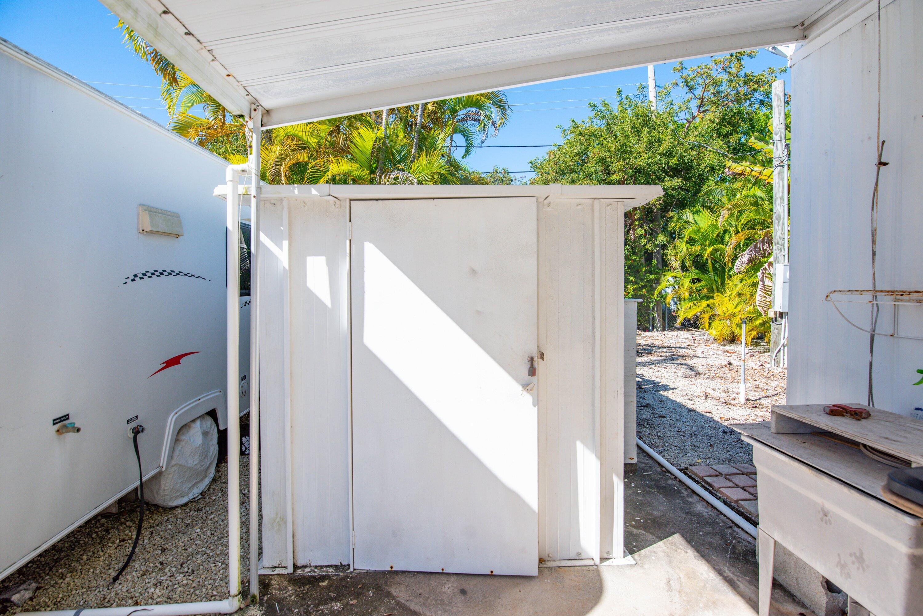 138 Sands Road Big Pine Key, FL 33043 - Photo 12 of 18 a view of a house with a porch