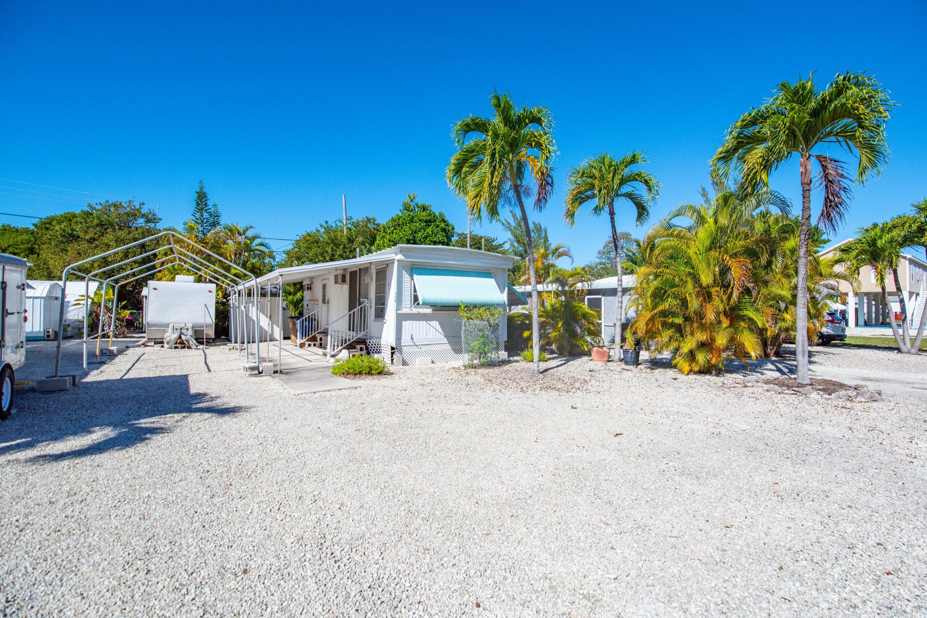 138 Sands Road Big Pine Key, FL 33043 - Photo 18 of 18 a view of a park with a table and chairs