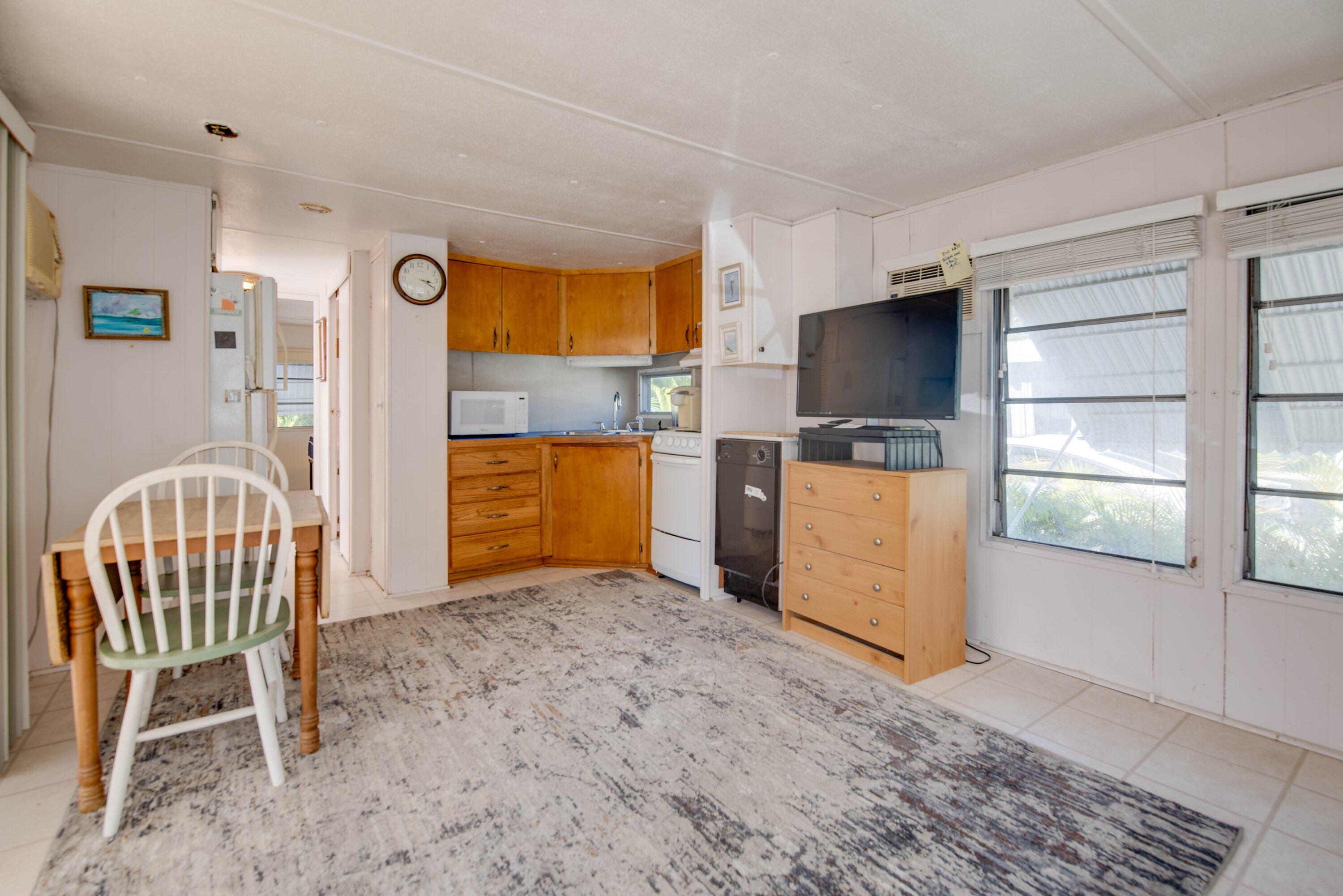 138 Sands Road Big Pine Key, FL 33043 - Photo 4 of 18 a view of workspace with window and wooden floor