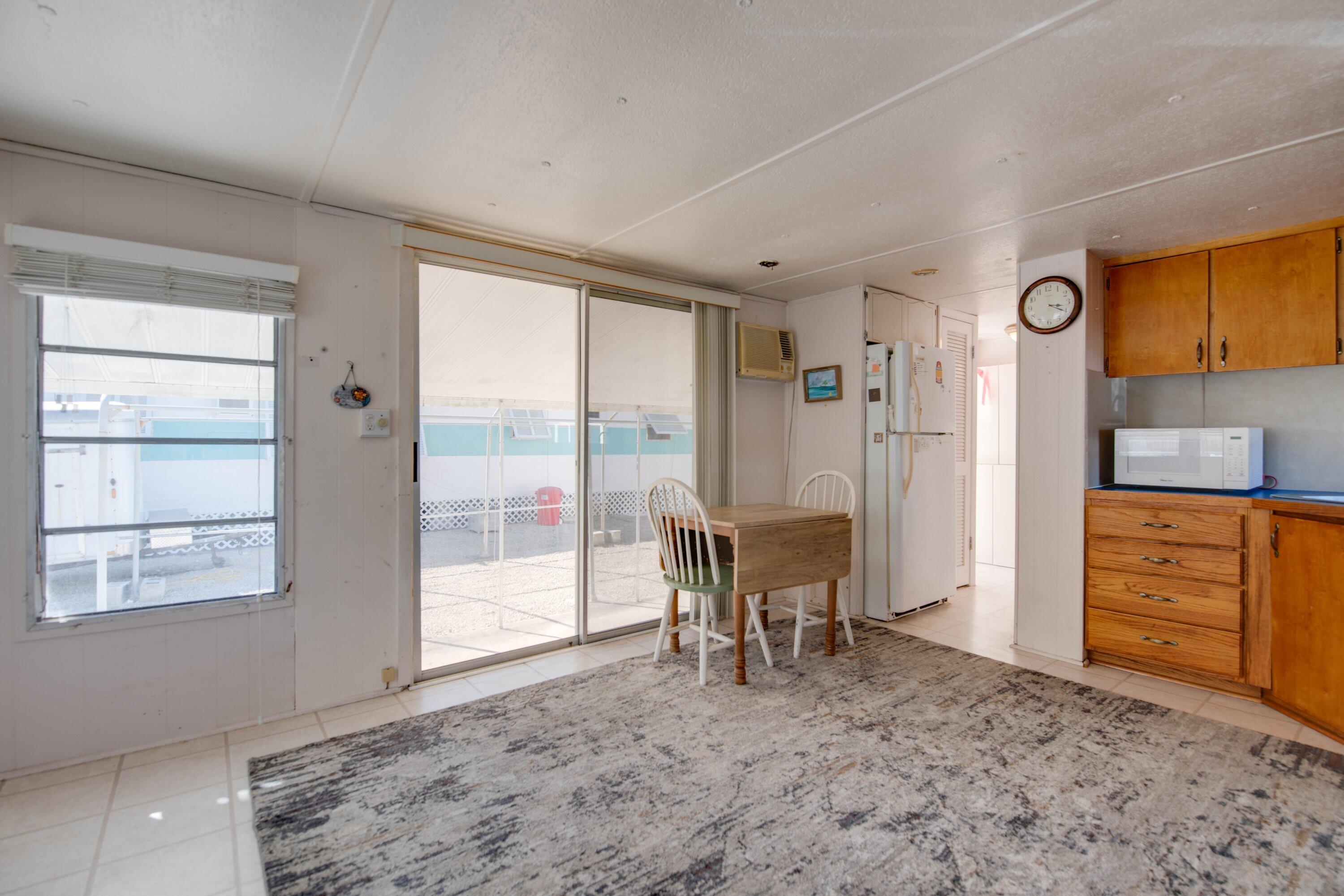 138 Sands Road Big Pine Key, FL 33043 - Photo 5 of 18 a view of a livingroom with furniture and front door