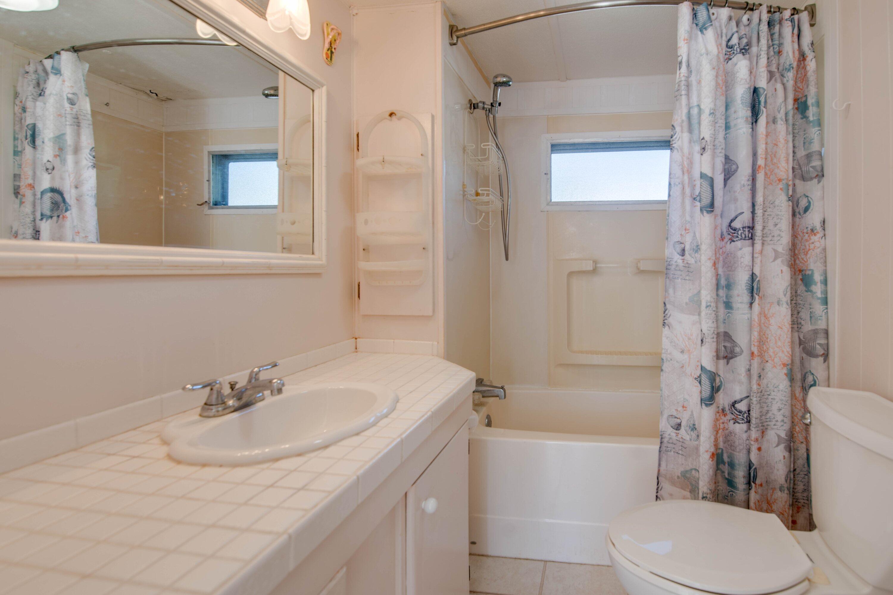138 Sands Road Big Pine Key, FL 33043 - Photo 7 of 18 a bathroom with a sink toilet and shower