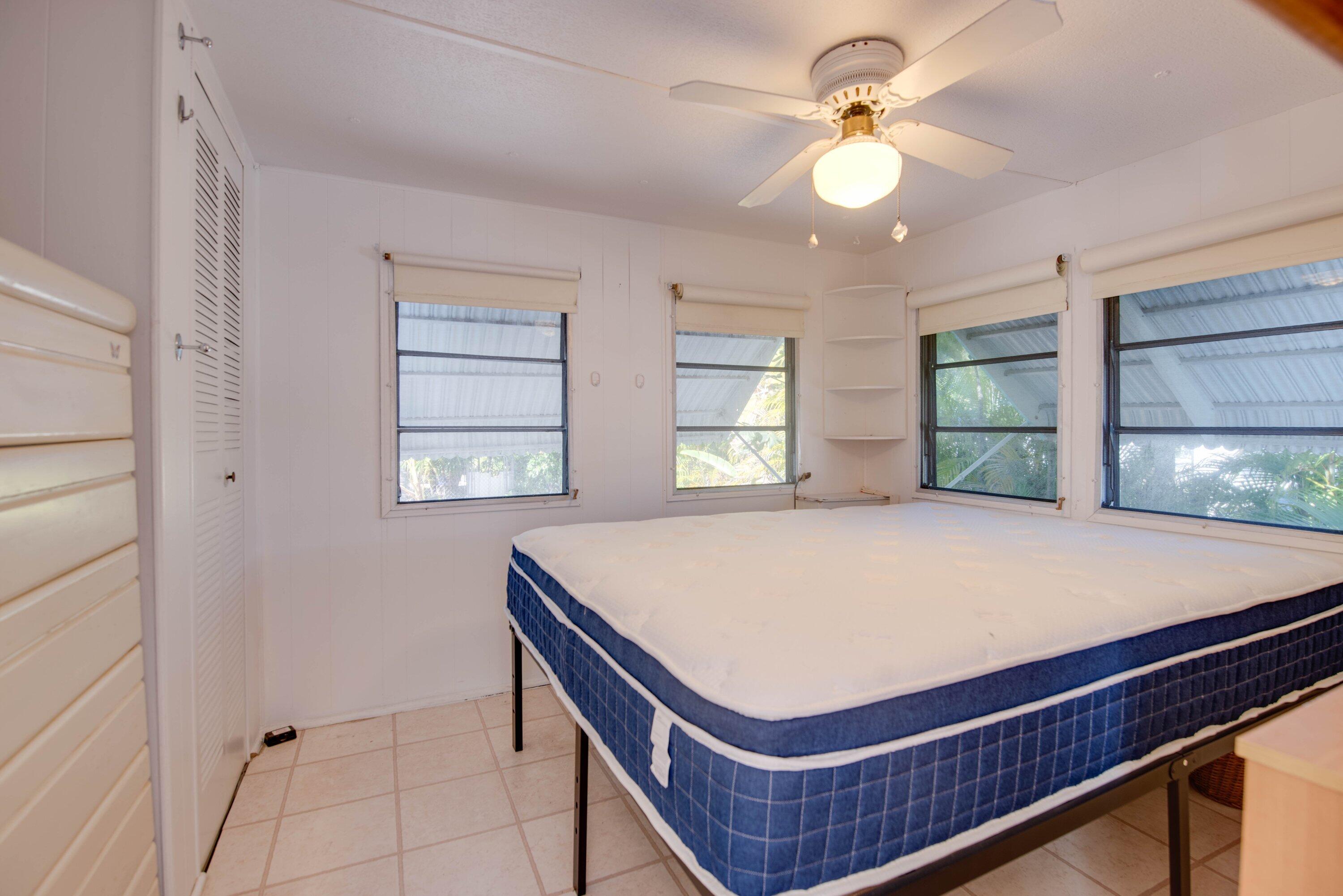 138 Sands Road Big Pine Key, FL 33043 - Photo 8 of 18 a room with pool table and windows